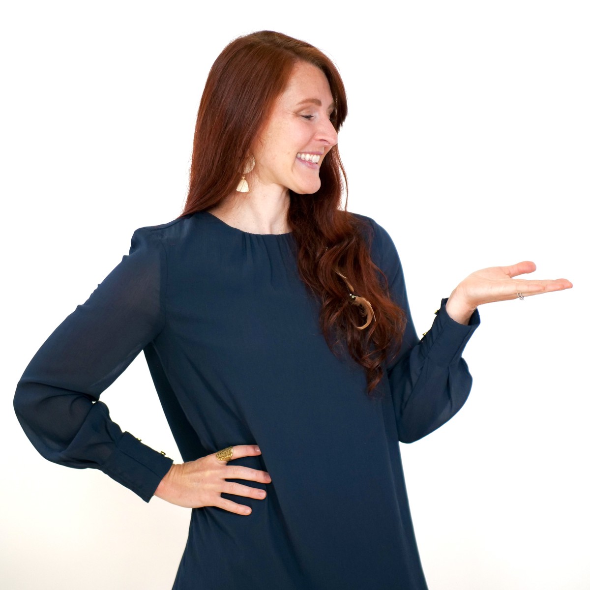 Kate Vazquez smiling and gesturing with an open hand