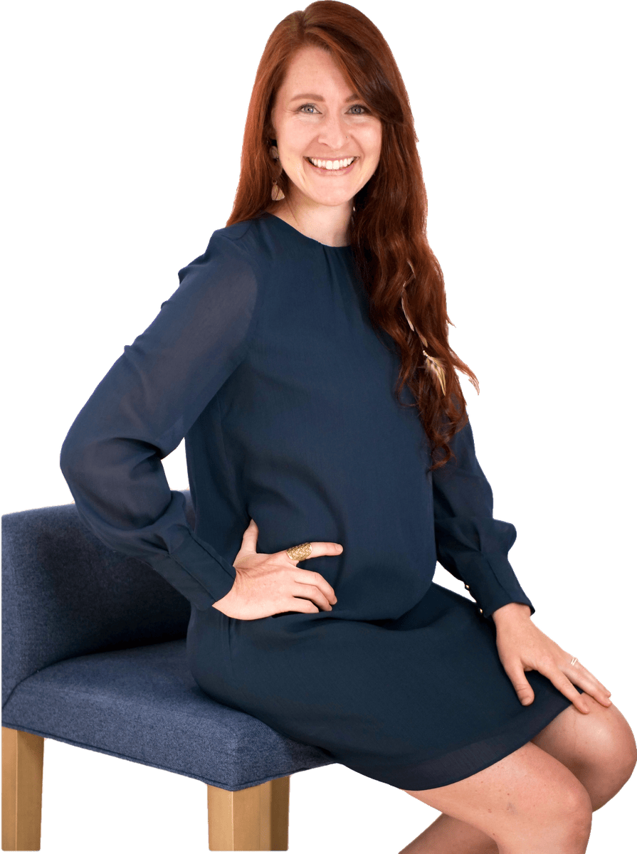 Kate Vazquez smiling, seated in a navy dress